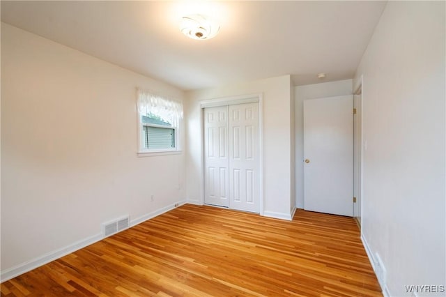 80 Hilton Blvd, Amherst, NY 14226 - unfurnished bedroom featuring light wood-style floors, a closet, and baseboards