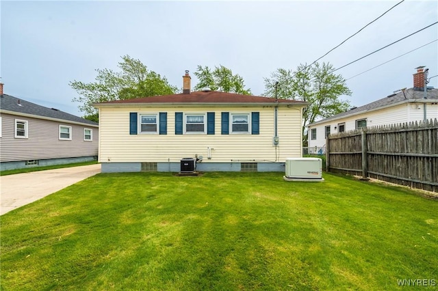 80 Hilton Blvd, Amherst, NY 14226 - rear view of house with central AC unit and a chimney