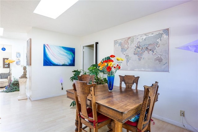 2804 Westinghouse Rd, Horseheads, NY 14845 - dining space with light wood-style flooring and a skylight
