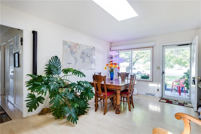 2804 Westinghouse Rd, Horseheads, NY 14845 - dining space featuring wood finished floors and a skylight