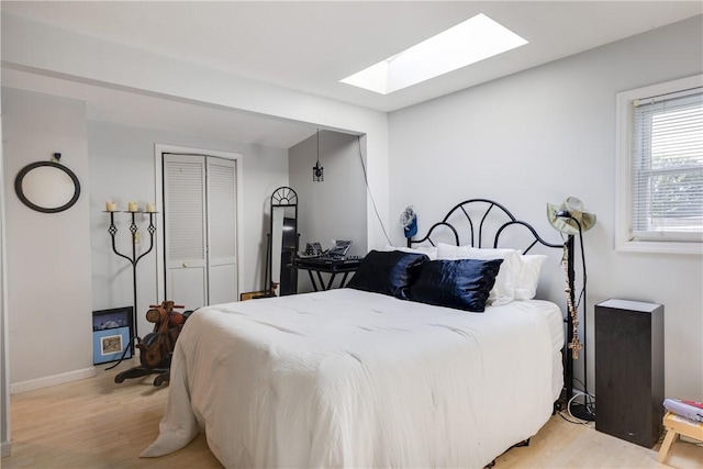 2804 Westinghouse Rd, Horseheads, NY 14845 - bedroom featuring a skylight, light wood-type flooring, and a closet