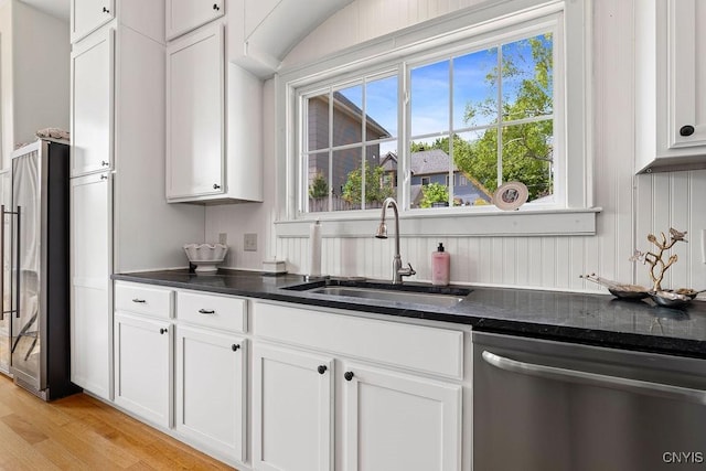 54 W 5th St, Oswego-City, NY 13126 - kitchen featuring appliances with stainless steel finishes, a sink, white cabinetry, and light wood-style flooring