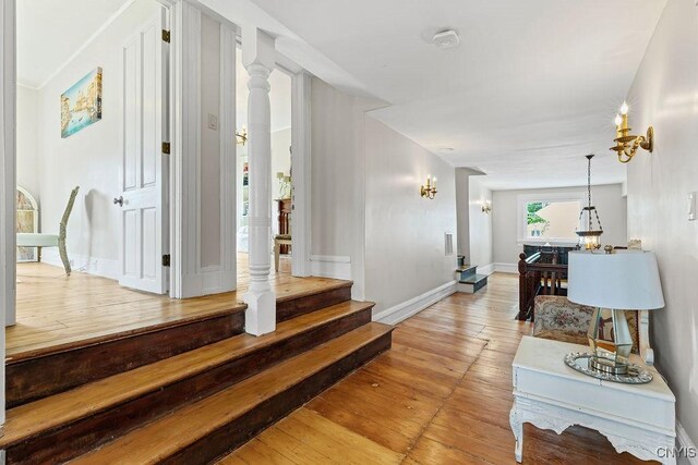 54 W 5th St, Oswego-City, NY 13126 - corridor with light wood-style flooring, baseboards, and stairs