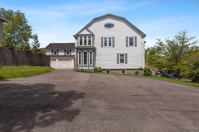 54 W 5th St, Oswego-City, NY 13126 - view of front of home with asphalt driveway and an attached garage