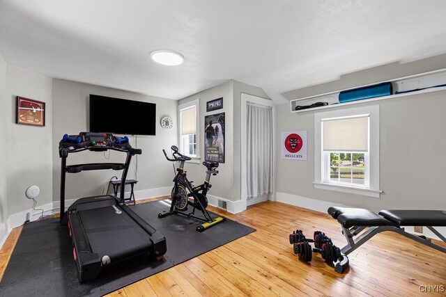 54 W 5th St, Oswego-City, NY 13126 - exercise room featuring wood-type flooring and baseboards
