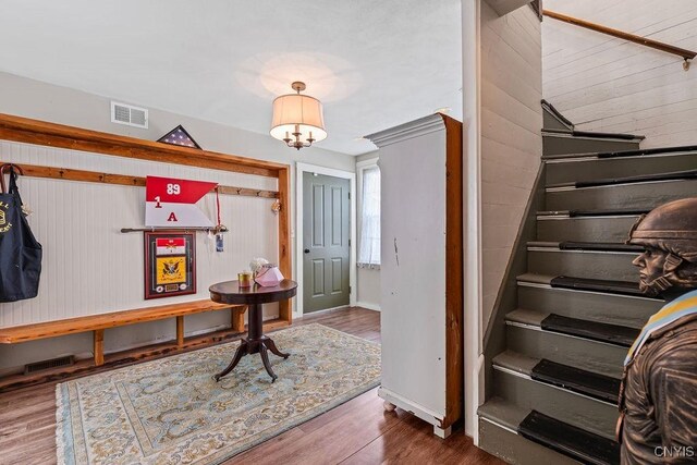 54 W 5th St, Oswego-City, NY 13126 - entrance foyer featuring stairs, baseboards, wood finished floors, and wooden walls