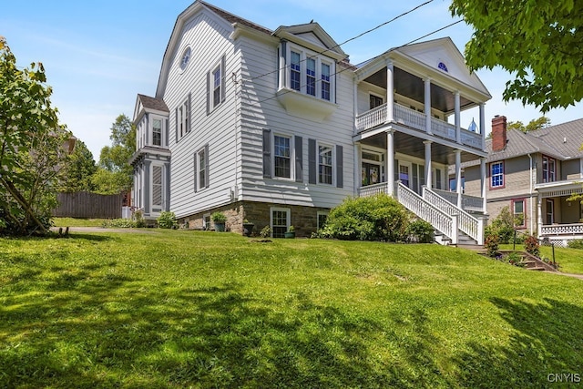 54 W 5th St, Oswego-City, NY 13126 - back of house with a balcony and a porch