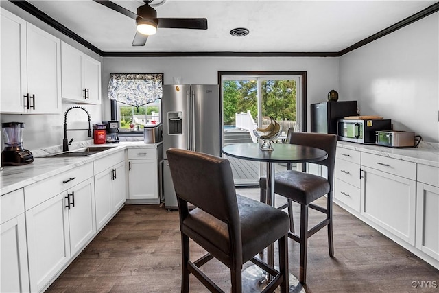 30 Bakeman St, Fulton, NY 13069 - kitchen featuring stainless steel appliances, a sink, dark wood finished floors, plenty of natural light, and ornamental molding