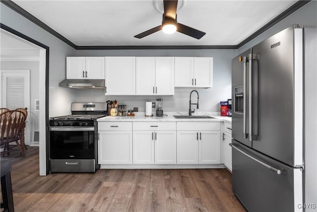 30 Bakeman St, Fulton, NY 13069 - kitchen featuring appliances with stainless steel finishes, a sink, ornamental molding, light countertops, and white cabinets
