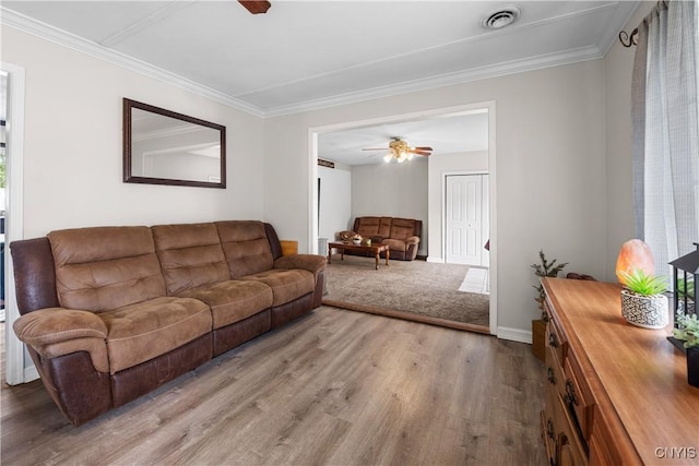 30 Bakeman St, Fulton, NY 13069 - living area featuring a ceiling fan, wood finished floors, ornamental molding, and baseboards