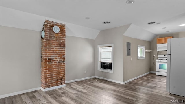 318 14th St, Buffalo, NY 14213 - unfurnished living room with vaulted ceiling, wood finished floors, baseboards, electric panel, and cooling unit