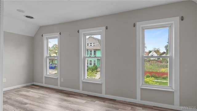 318 14th St, Buffalo, NY 14213 - doorway with light wood finished floors, lofted ceiling, and baseboards