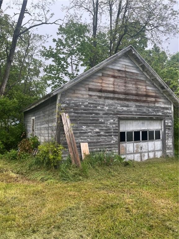 8193 State Highway 206, Tompkins, NY 13839 - view of property exterior featuring a garage and an outdoor structure