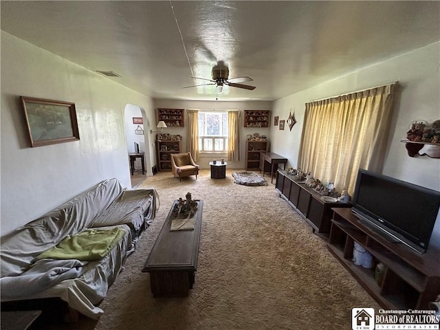 12298 Alleghany Rd, Hanover, NY 14136 - living room with arched walkways, carpet, and a ceiling fan