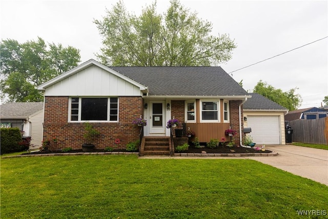 50 Cambria St, Lancaster, NY 14086 - view of front of property with brick siding, driveway, and an attached garage