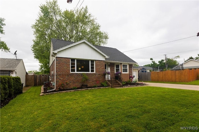 50 Cambria St, Lancaster, NY 14086 - view of front of property featuring brick siding, driveway, a garage, and board and batten siding
