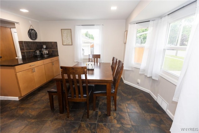 50 Cambria St, Lancaster, NY 14086 - dining room featuring plenty of natural light, dark stone finish floors, and baseboards