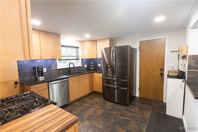 50 Cambria St, Lancaster, NY 14086 - kitchen with appliances with stainless steel finishes, a sink, tasteful backsplash, stone finish flooring, and dark countertops