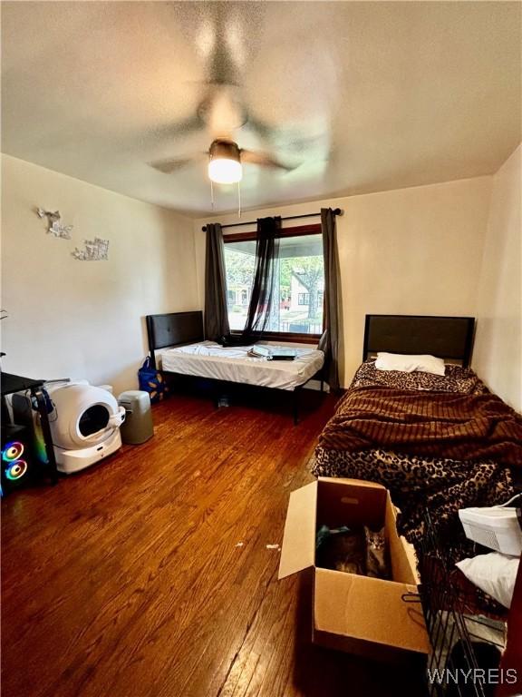 761 4th St, Niagara Falls, NY 14301 - bedroom with wood finished floors and a ceiling fan