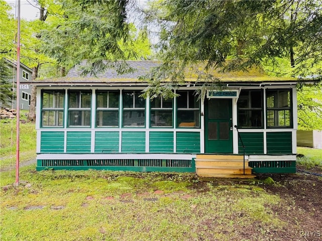 274 S Shore Rd, Webb, NY 13420 - rear view of house with a sunroom