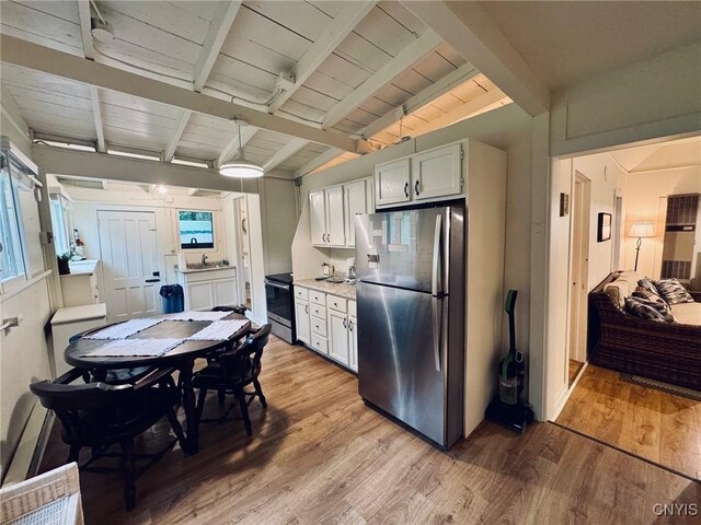 274 S Shore Rd, Webb, NY 13420 - kitchen featuring stainless steel appliances, light wood-style floors, light countertops, healthy amount of natural light, and wooden ceiling