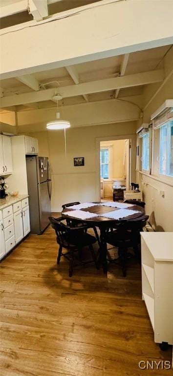 274 S Shore Rd, Webb, NY 13420 - dining room with light wood-type flooring and beam ceiling