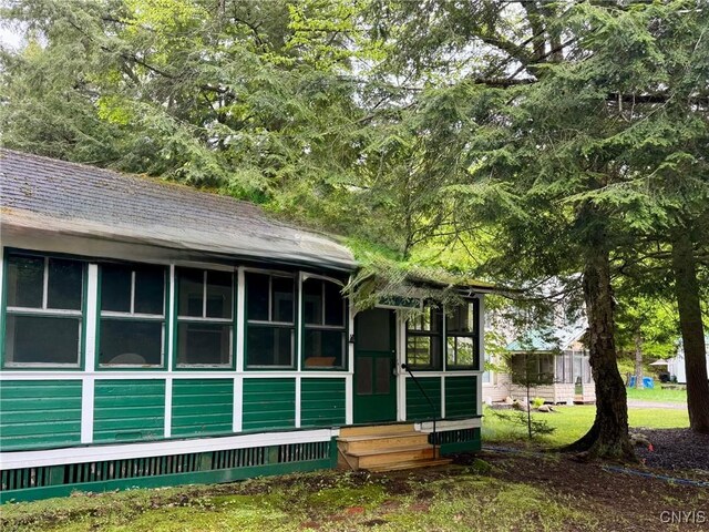 274 S Shore Rd, Webb, NY 13420 - view of front of property featuring entry steps and a sunroom