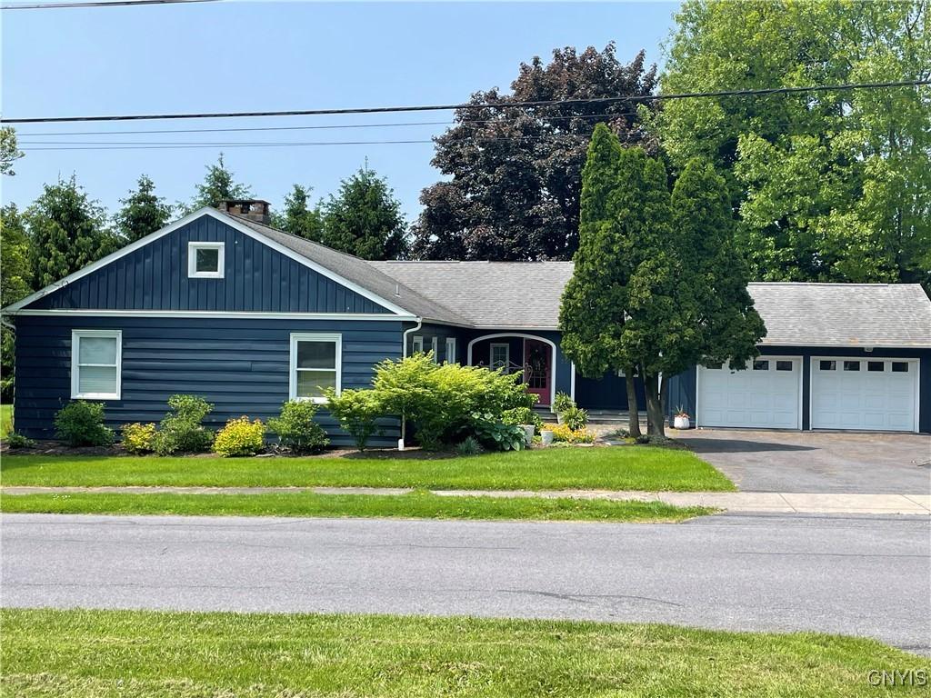25 S Hunter Ave S, Auburn, NY 13021 - single story home with driveway, a front yard, and a chimney