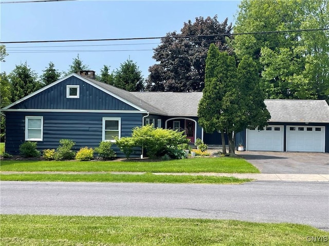 25 S Hunter Ave S, Auburn, NY 13021 - single story home with driveway, a front yard, and a chimney