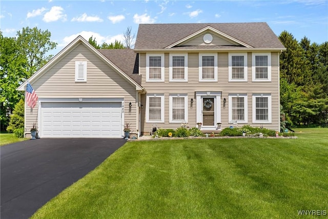 1660 Shallow Creek Trl, Webster, NY 14580 - colonial inspired home with asphalt driveway, a front yard, an attached garage, and a shingled roof