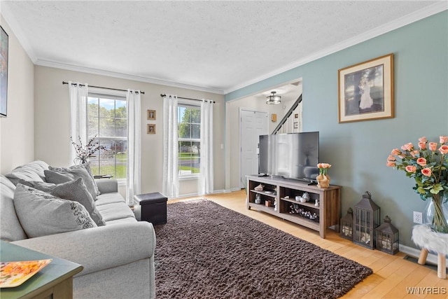 1660 Shallow Creek Trl, Webster, NY 14580 - living area with wood-type flooring, crown molding, a textured ceiling, and baseboards