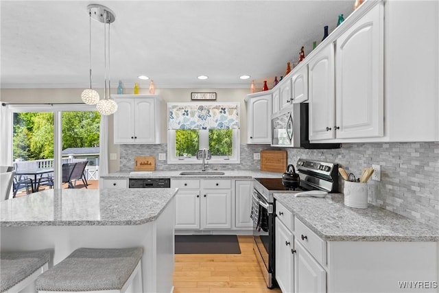 1660 Shallow Creek Trl, Webster, NY 14580 - kitchen with appliances with stainless steel finishes, a sink, white cabinetry, plenty of natural light, and recessed lighting