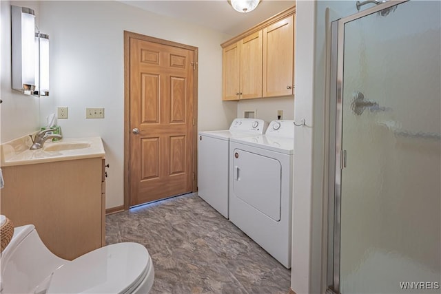 8654 Rochester Rd, Royalton, NY 14067 - bathroom featuring independent washer and dryer, a stall shower, vanity, and toilet