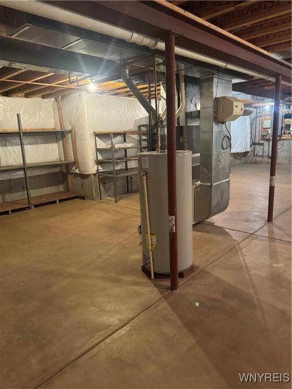 8654 Rochester Rd, Royalton, NY 14067 - unfinished basement featuring water heater and heating unit