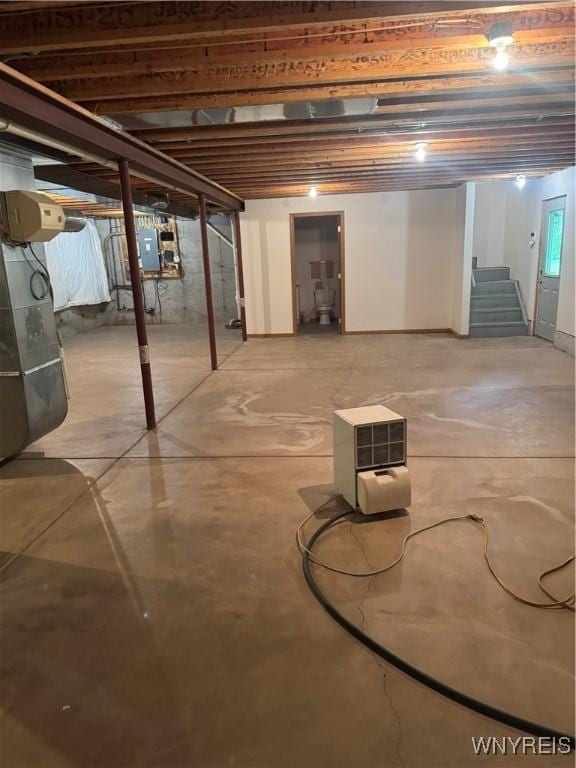 8654 Rochester Rd, Royalton, NY 14067 - unfinished basement featuring stairs, electric panel, and heating unit