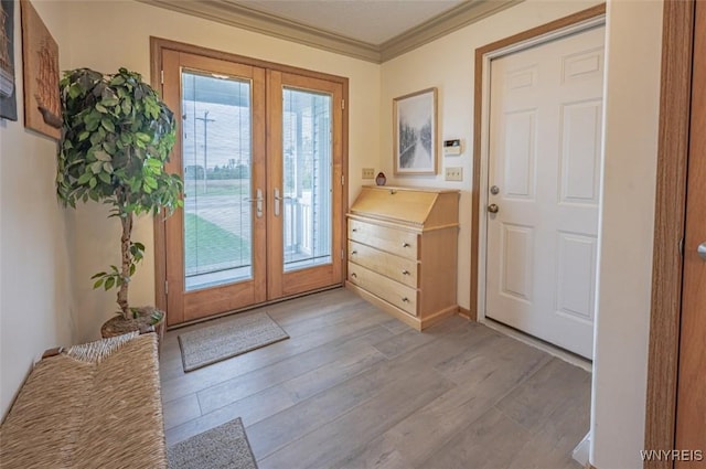 8654 Rochester Rd, Royalton, NY 14067 - entryway featuring french doors, light wood finished floors, and crown molding