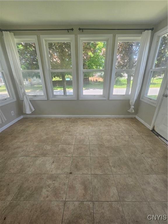 25 Vincent St, Champion, NY 13619 - unfurnished sunroom featuring baseboards