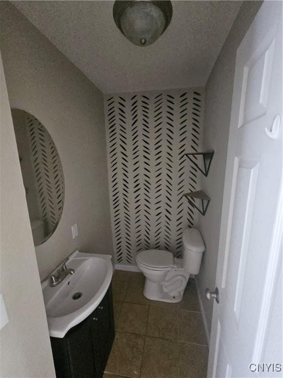 25 Vincent St, Champion, NY 13619 - bathroom with vanity, toilet, tile patterned flooring, and a textured ceiling