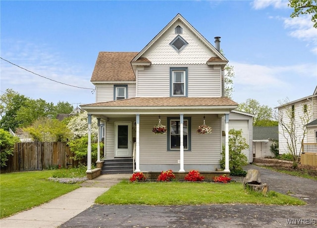 2654 Main St, Newfane, NY 14108 - victorian house with covered porch and roof with shingles