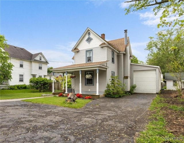 2654 Main St, Newfane, NY 14108 - victorian house with a porch, driveway, a chimney, a front lawn, and roof with shingles
