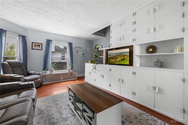 2654 Main St, Newfane, NY 14108 - living area with a textured ceiling and wood finished floors