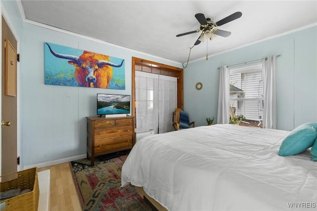 2654 Main St, Newfane, NY 14108 - bedroom featuring crown molding, wood finished floors, baseboards, and a ceiling fan