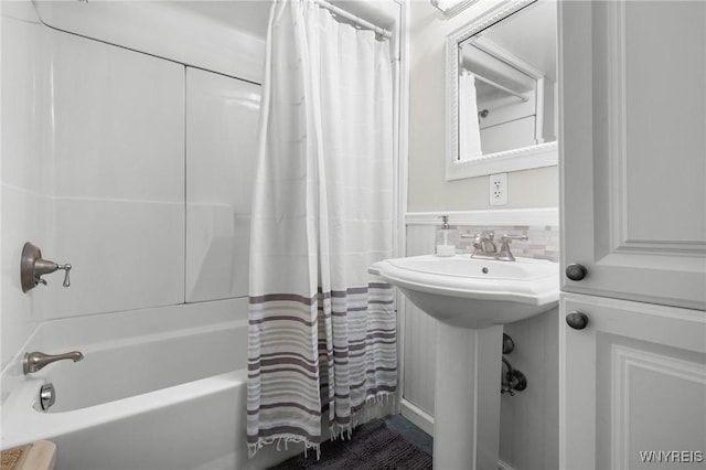 2654 Main St, Newfane, NY 14108 - full bathroom featuring shower / tub combo with curtain, a wainscoted wall, and tile walls