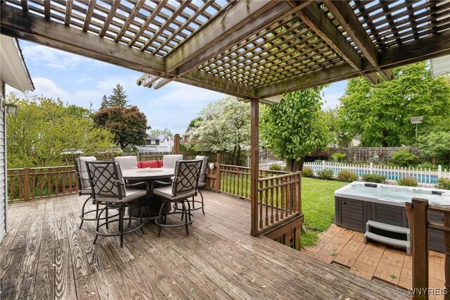 2654 Main St, Newfane, NY 14108 - wooden deck featuring a hot tub, a pergola, a fenced backyard, and outdoor dining area