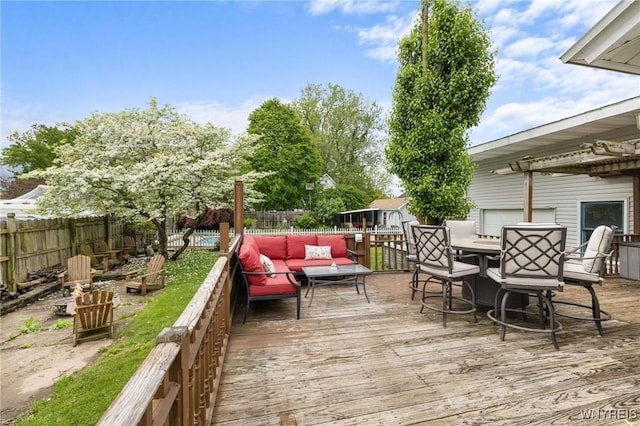 2654 Main St, Newfane, NY 14108 - wooden deck featuring an outdoor living space and a fenced backyard