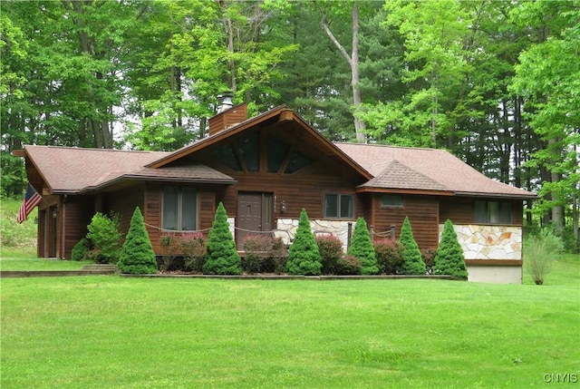 47089 County Route 100, Alexandria, NY 13640 - view of front of house featuring a chimney, a front lawn, stone siding, and roof with shingles