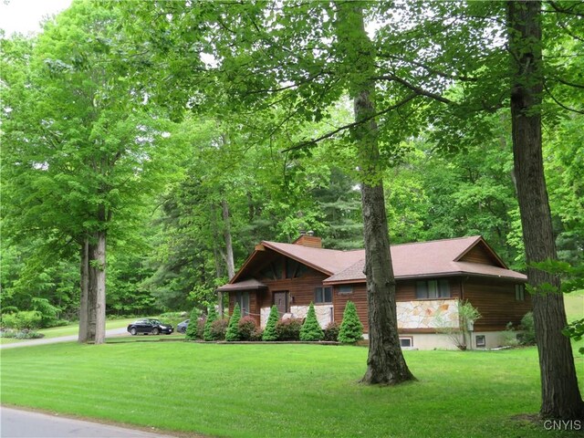 47089 County Route 100, Alexandria, NY 13640 - view of front of home with a front lawn and a chimney