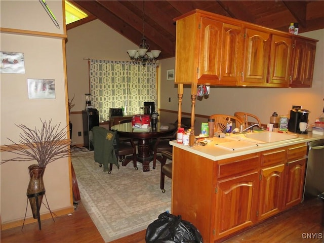 47089 County Route 100, Alexandria, NY 13640 - kitchen with lofted ceiling, dishwasher, wood finished floors, a chandelier, and light countertops
