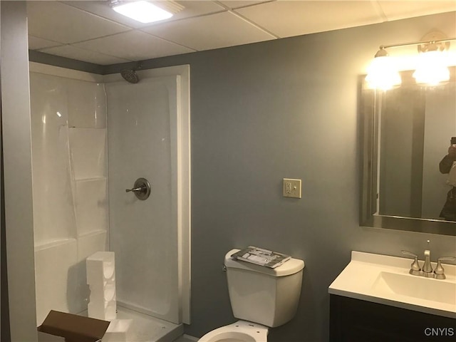 47089 County Route 100, Alexandria, NY 13640 - bathroom featuring toilet, a stall shower, a paneled ceiling, and vanity