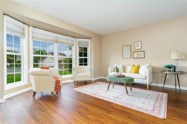 65 Geraldine Pkwy, Gates, NY 14624 - living area featuring plenty of natural light, wood finished floors, and baseboards